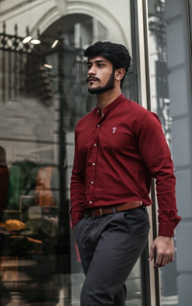 Man in Red Dress Shirt Near Wall