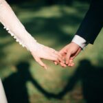 man and woman holding hands focus photo