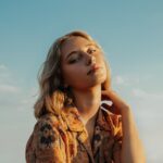 woman in brown and black floral button up shirt